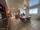 Open floor plan showing the kitchen and dining area with tile flooring and natural light at 10402 N Balboa Dr, Sun City, AZ 85351