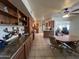 Spacious open-concept kitchen and dining area featuring tile floors and wood cabinetry at 10402 N Balboa Dr, Sun City, AZ 85351