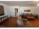 Open living room with hardwood floors and view to kitchen at 10402 N Balboa Dr, Sun City, AZ 85351