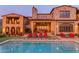 Luxurious backyard with pool, outdoor dining area, and covered patio for seamless entertaining at 10935 E Grandview Way, Scottsdale, AZ 85255