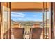 Relaxing balcony with comfortable chairs offering a panoramic view of the mountain landscape at 10935 E Grandview Way, Scottsdale, AZ 85255