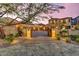 Estate home featuring a large driveway, multiple garages, and meticulous landscaping at 10935 E Grandview Way, Scottsdale, AZ 85255