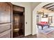 Wood paneled elevator with door open to reveal the game room at 10935 E Grandview Way, Scottsdale, AZ 85255