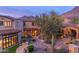 Beautiful home with a well-manicured yard, stone accents, and a charming exterior design at 10935 E Grandview Way, Scottsdale, AZ 85255