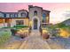 Charming Mediterranean style home with mature landscaping and brick walkway at 10935 E Grandview Way, Scottsdale, AZ 85255