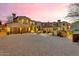 Beautiful home with multiple garages, mature trees, and a spacious driveway at 10935 E Grandview Way, Scottsdale, AZ 85255