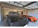 Well-organized garage with storage and space for multiple vehicles; Range Rover and Lamborghini at 10935 E Grandview Way, Scottsdale, AZ 85255