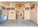 Spacious garage featuring a Pennzoil sign and automotive decor leading to an additional room at 10935 E Grandview Way, Scottsdale, AZ 85255