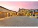 Home with ample garage space, featuring multiple garages and a large motor court at 10935 E Grandview Way, Scottsdale, AZ 85255