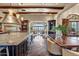 Gourmet kitchen with custom cabinets, granite countertops and a view to the living area at 10935 E Grandview Way, Scottsdale, AZ 85255