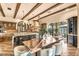 Open kitchen and dining area featuring a kitchen island and stainless steel appliances at 10935 E Grandview Way, Scottsdale, AZ 85255
