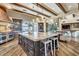 Kitchen island with granite countertops, pendant lighting and stainless steel appliances at 10935 E Grandview Way, Scottsdale, AZ 85255