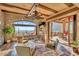 Inviting living room featuring floor-to-ceiling windows with views and comfortable seating at 10935 E Grandview Way, Scottsdale, AZ 85255