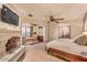 Serene main bedroom with a fireplace and a separate seating area at 10935 E Grandview Way, Scottsdale, AZ 85255