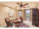 Comfortable home office with desk, chairs, and natural light with a view of the outside at 10935 E Grandview Way, Scottsdale, AZ 85255