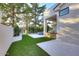 Lush backyard featuring an outdoor kitchen, patio, and artificial turf, perfect for entertaining guests at 11578 N 80Th Pl, Scottsdale, AZ 85260