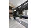 Modern bathroom featuring a soaking tub, double sink vanity, luxurious countertops, and marble flooring at 11578 N 80Th Pl, Scottsdale, AZ 85260