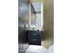 Stylish bathroom featuring a modern vanity, gleaming gold tiled walls, and a mirrored wall for an elegant touch at 11578 N 80Th Pl, Scottsdale, AZ 85260