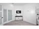 Alternative view of a contemporary bedroom with a murphy bed and closet with a door at 11578 N 80Th Pl, Scottsdale, AZ 85260