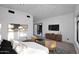 Bedroom featuring decor, light wood floors, furniture, and a view to hallway at 11578 N 80Th Pl, Scottsdale, AZ 85260