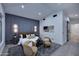 A bright bedroom boasts an accent wall, cozy chairs, and ample natural light at 11578 N 80Th Pl, Scottsdale, AZ 85260