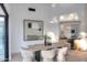 Dining room showcases modern decor, sleek lighting, neutral accents, and backyard views at 11578 N 80Th Pl, Scottsdale, AZ 85260