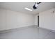 Bright garage featuring clean, epoxy flooring and ample wall space at 11578 N 80Th Pl, Scottsdale, AZ 85260