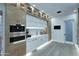 Stylish kitchen featuring custom cabinets, marble countertops, and modern fixtures for a luxurious cooking space at 11578 N 80Th Pl, Scottsdale, AZ 85260