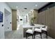 Modern kitchen featuring a marble island with bar seating at 11578 N 80Th Pl, Scottsdale, AZ 85260