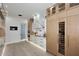 Well-designed kitchen featuring custom cabinets, marble backsplash, modern appliances, and a built-in wine cooler at 11578 N 80Th Pl, Scottsdale, AZ 85260