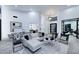 Bright living room featuring hardwood floors and designer furniture at 11578 N 80Th Pl, Scottsdale, AZ 85260