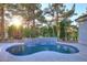 Backyard pool featuring a tiled waterfall feature and mature trees for privacy and shade at 11578 N 80Th Pl, Scottsdale, AZ 85260