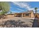 A home's exterior with large backyard and covered patio at 11844 N 146Th Ave, Surprise, AZ 85379