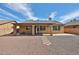 Spacious backyard with covered patio and minimal landscaping at 11844 N 146Th Ave, Surprise, AZ 85379