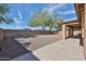 A large backyard with low maintenace landscaping, and a covered patio at 11844 N 146Th Ave, Surprise, AZ 85379