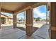 Inviting covered front porch with decorative columns and desert landscaping at 11844 N 146Th Ave, Surprise, AZ 85379