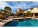 Backyard featuring a sparkling blue pool, desert landscaping, and nearby home at 1213 W Deoni Trl, San Tan Valley, AZ 85143