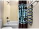 Bathroom featuring a bathtub and shower, with a matching shower curtain and towel at 1213 W Deoni Trl, San Tan Valley, AZ 85143