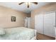 Bedroom with large double door closet and a ceiling fan for added comfort at 1213 W Deoni Trl, San Tan Valley, AZ 85143