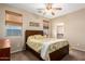 Comfortable bedroom featuring a ceiling fan and a window offering outside views at 1213 W Deoni Trl, San Tan Valley, AZ 85143