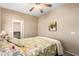 Comfortable bedroom featuring a ceiling fan, neutral walls and carpet, and closet access at 1213 W Deoni Trl, San Tan Valley, AZ 85143