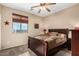 Comfortable bedroom featuring a ceiling fan and a window with picturesque view at 1213 W Deoni Trl, San Tan Valley, AZ 85143