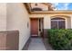 Welcoming front entry featuring a stylish door, sidelight window, and neat landscaping at 1213 W Deoni Trl, San Tan Valley, AZ 85143