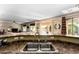 A stainless kitchen sink overlooks the living room and the gorgeous backyard pool at 1213 W Deoni Trl, San Tan Valley, AZ 85143