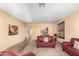 Bright living room with neutral walls, plush furniture, and elegant decorative accents at 1213 W Deoni Trl, San Tan Valley, AZ 85143