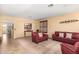 Bright living room with neutral walls, plush furniture, and elegant decorative accents at 1213 W Deoni Trl, San Tan Valley, AZ 85143