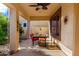 Covered patio with dining table set, providing an inviting outdoor space for meals and relaxation at 1213 W Deoni Trl, San Tan Valley, AZ 85143