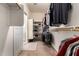 Spacious walk-in closet with built-in shelves and ample storage for clothing and accessories at 1213 W Deoni Trl, San Tan Valley, AZ 85143