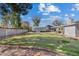 Expansive backyard featuring a covered pool, well-maintained lawn, and a charming patio area at 1331 E Bates St, Mesa, AZ 85203