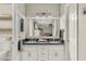 Bathroom features a dual sink vanity with granite countertop and decorative mirror at 1331 E Bates St, Mesa, AZ 85203